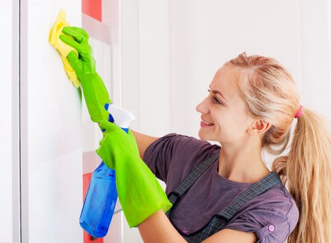 Builders cleaning after renovation work in Greenwich home