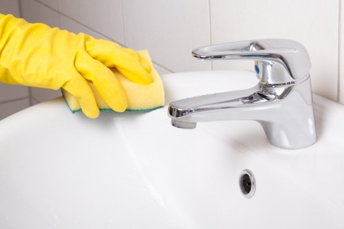 Local cleaning team carrying out detailed kitchen and bathroom cleaning in Greenwich